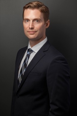 Lawyer Corporate Headshot on Grey Background by Vancouver Photographer Rob Trendiak